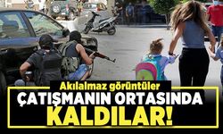 Akılalmaz görüntüler! Çatışmanın ortasında kaldılar!