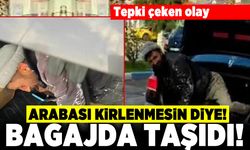 Tepki çeken olay! Arabası kirlenmesin diye! Bagajında taşıdı
